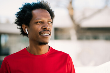 Afro athlete man standing outdoors.