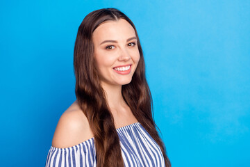 Photo of sweet shiny young lady wear off-shoulders clothes empty space smiling isolated blue color background