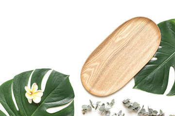 Top view tropical leaves on vibrant background. Summer flat lay composition.