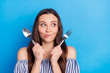 Photo portrait woman hungry wait for dinner with fork knife biting lip looking copyspace isolated...