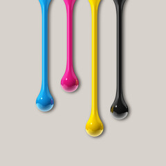 cmyk ink drops on grey paper square background