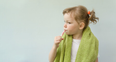 Cute little girl is brushing her teeth.