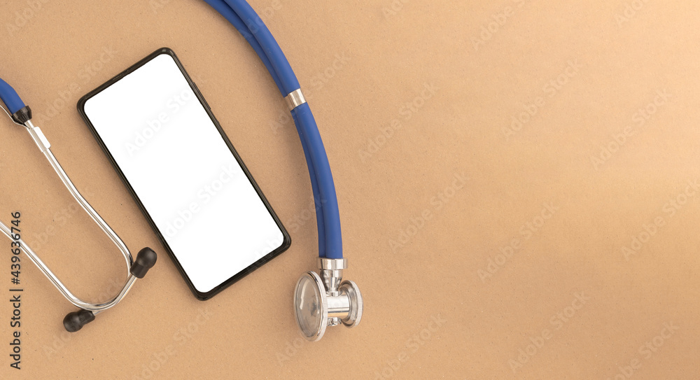 Leinwandbilder Mobile phone mock up with stethoscope. Template with white screen of smartphone at desk for medical application.