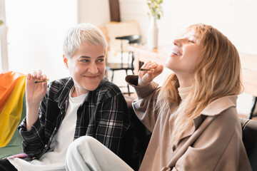 Relaxed high stoned young girlfriends lesbians women smoking weed marijuana cannabis tobacco hashish joint cigarette. Drug legalization concept. Smoking addiction, rave party. Passive smoking