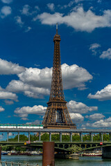 Fototapeta na wymiar The Eiffel Tower is a wrought-iron lattice tower on the Champ de Mars in Paris.