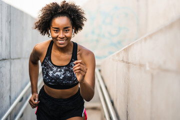 Afro athlete woman running outdoors.