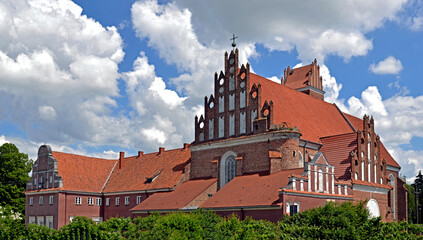 Fototapeta na wymiar Built at the turn of the 16th and 17th centuries, the Gothic Catholic Church of Saints James and Anna in the city of Przasnysz in Masovia, Poland. The photos show a general view, architectural details