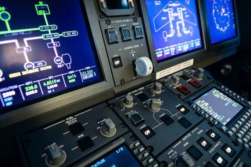 A typical dashboard panel in the cockpit of a private jet plane aircraft. Gear lever in focus.