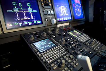 A typical dashboard panel in the cockpit of a private jet plane aircraft.  - obrazy, fototapety, plakaty