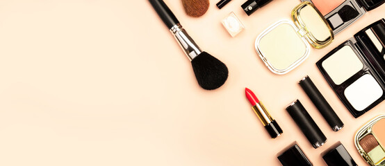 Professional Decorative Cosmetics, make-up products and accessories on nude pink background, minimal style. Beauty, fashion, visage and shopping blogger concept. Copy space banner