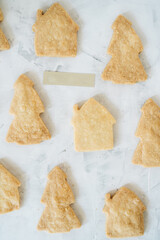 Flat lay of gingerbread with shape of christmas tree and houses