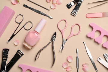 Zelfklevend Fotobehang Composition with manicure and pedicure tools on beige background, flat lay © New Africa