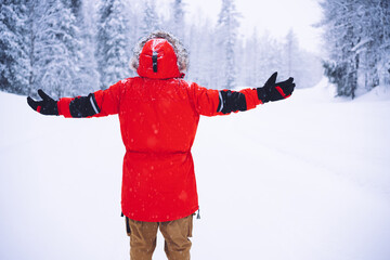 Fototapeta na wymiar Anonymous hiker enjoying freedom in winter