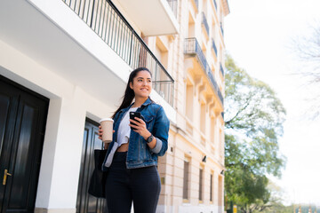 Young woman using her mobile phone.