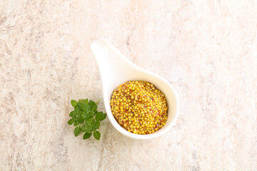 Grain mustard sauce in the bowl