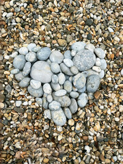 Light stone heart on the beach