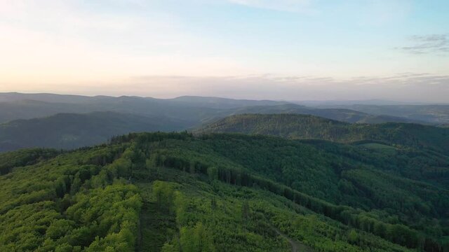 Scenery of the Silesian Beskids from Rownica peak at sunrise. Poland
