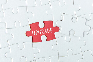 The word upgrade on a missing puzzle piece - business concept.