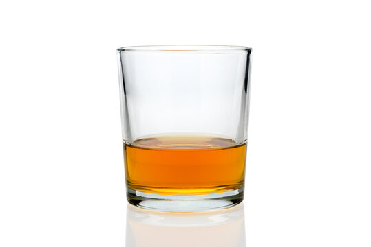 glass of whiskey or whisky or american Kentucky bourbon with its reflection on the plane. isolated on white.