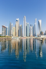 Fototapeta na wymiar Dubai Marina and Harbour skyline architecture travel in United Arab Emirates water reflection portrait format