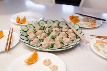 Fototapeta na wymiar Steamed Dumplings with Cucumber Slices