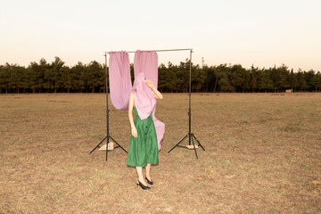 model playing with setup outdoors