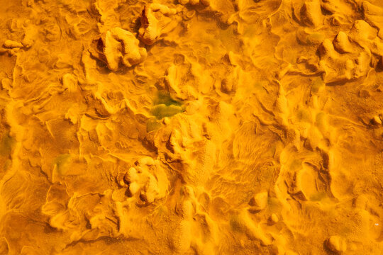 Abstract background of river with red and orange water