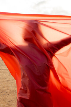 woman with red fabric