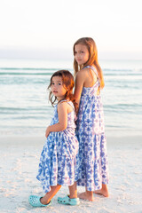 Sisters in Matching Dresses on Beach