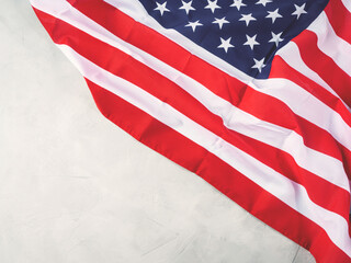 American stars and stripes flag on gray concrete background
