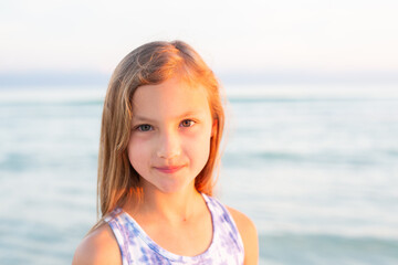 Fototapeta na wymiar Little Girl on Beach at Dusk