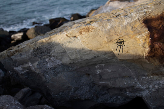 Drawing on rock in mountains