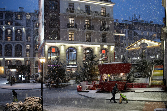 Modern city street during heavy snowfall