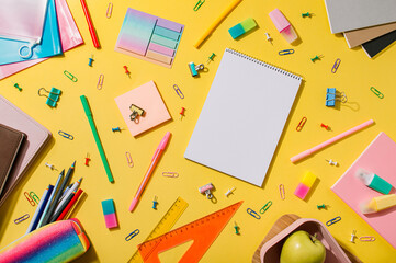 Education and freelancer work concept. School supplies, stationery accessories on yellow background. Flat lay, top view. Copy space