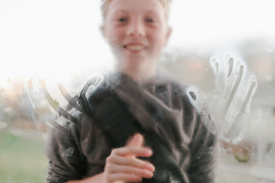 Child's Handprints on Window