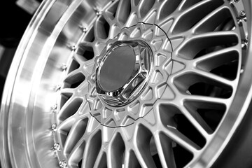 Silver alloy wheels on a car, close-up. Purchase and replacement of autodisks