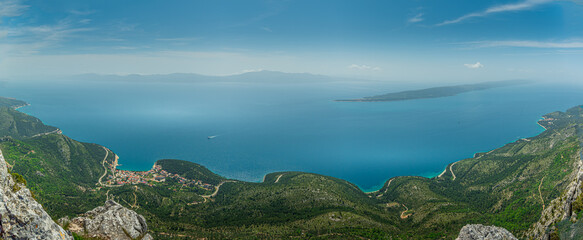 Fototapeta na wymiar Panorama of city Drvenik, peninsula Peljesac and island Hvar in the background.View from Rilic mountain. South Dalmatia, Croatia.