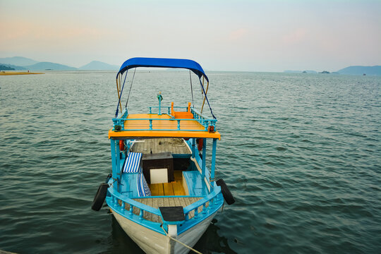 Charming blue and yellow boat in the sea