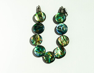 
Necklace of natural stones, photo on a white table