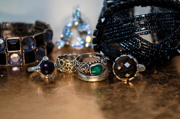 
Old metal rings with precious and mineral stones, old bracelets and necklaces