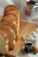 delicious sliced bread on a wooden board for breakfast