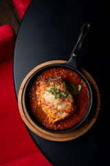 Side view ground beef lasagna with tomato sauce