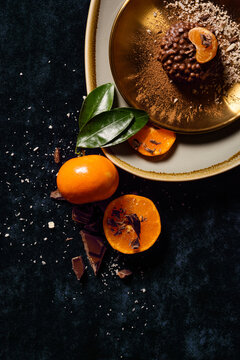 Crunchy chocolate dessert with orange slice and chocolate garnish