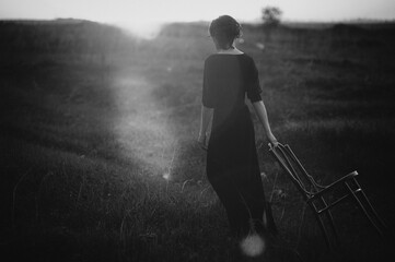 Young woman rambling with a chair