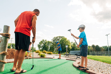 A friendly game of putt-putt golf as a family. 