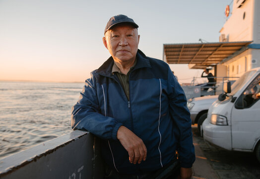 Portrait Of An Old Man On A Ferry