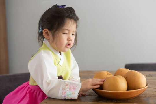Little kid with korean pears