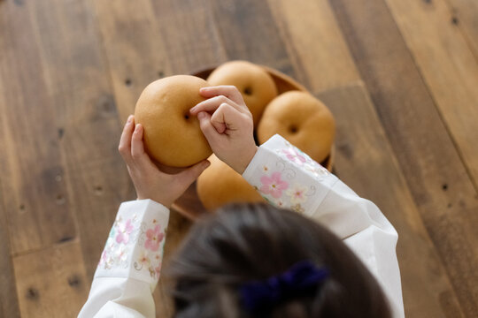 Little kid with korean pears