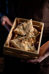 Pizza slices in a basket as a cold appetizer in a pizzeria