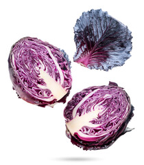 Two halves of red cabbage and a leaf are flying on a white. Isolated